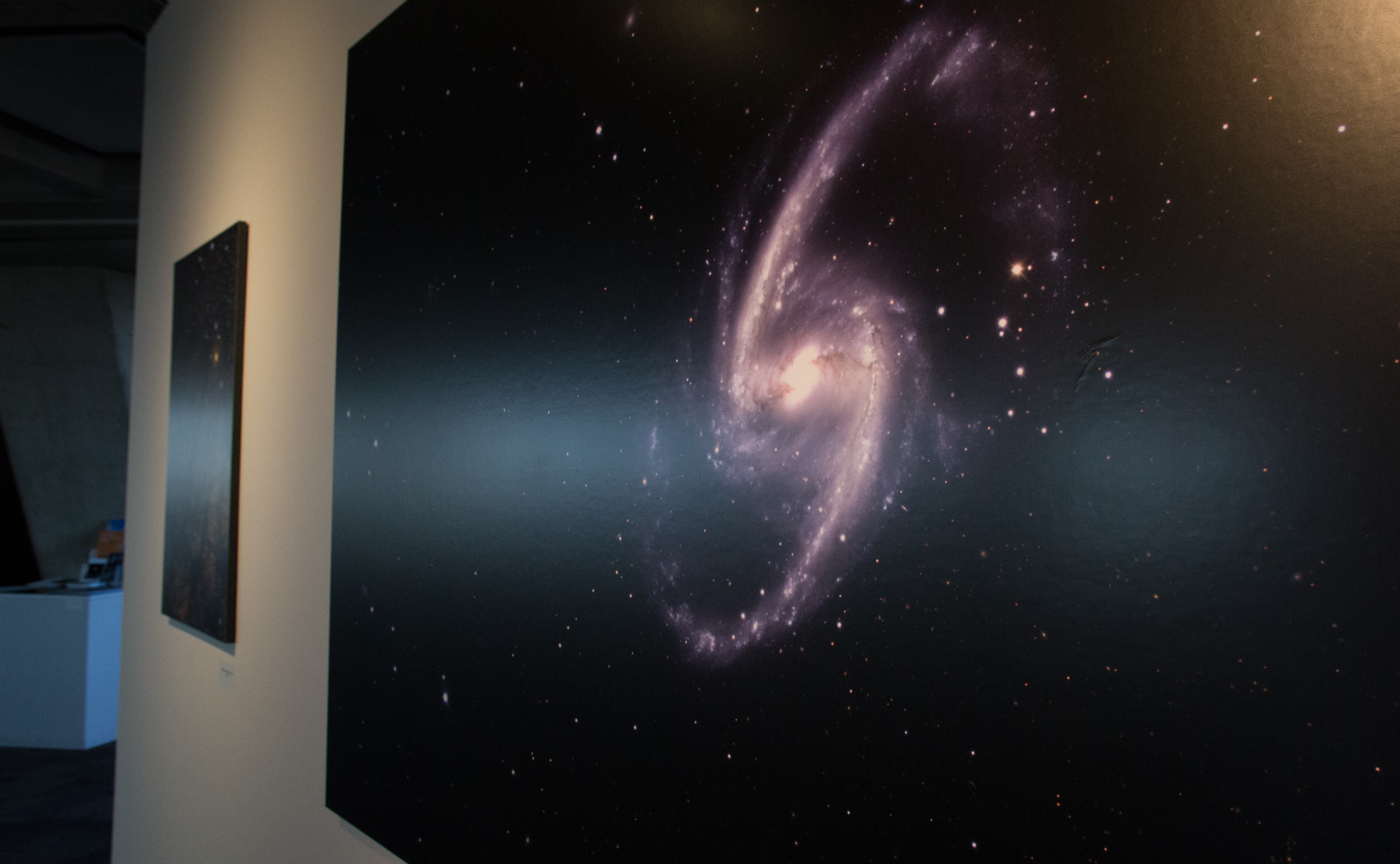 Nikolay Kuropatkin, Marty Murphy, Brian Nord and Brian Yanny created this photo of a galaxy, currently on display as part of the "Art of Darkness" exhibit in the Fermilab Art Gallery. A reception takes place on March 18 from 5-7 p.m. Photo of the photo: Rashmi Shivni