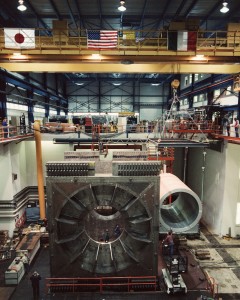 This photo, taken in 1984, shows the Japanese, United States and Italian flags flying over the CDF detector. Photo: Fermilab