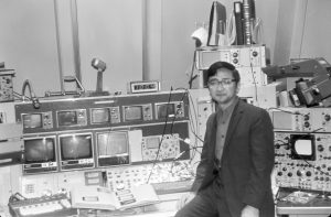 Ryuji Yamada is one of the scientists who, in 1972, helped the Main Ring accelerator achieve 100 and up to 200 billion electronvolts. In this picture, 100 billion electronvolts is indicated in the meter just above the controls. Photo: Fermilab