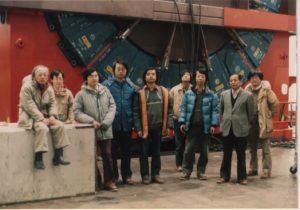 Scientists from the University of Tsukuba and KEK stand in front of the CDF detector in 1984 at Fermilab. From left: Shoji Mikamo, Yoshio Hayashide, Akihiro Yamashita, Hitoshi Miyata, Kiyoshi Yasuoka, Taku Yamanaka, Shinhong Kim, Kuni Kondo, Yoshinobu Takaiwa. Photo courtesy of Shinhong Kim