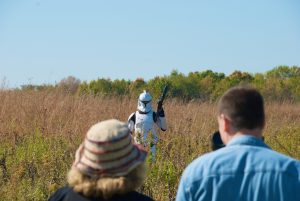 An imperial stormtrooper stands in the Fermilab prairie while filming scenes for unofficial fan-film "Star Wars: Forgotten Realm." 