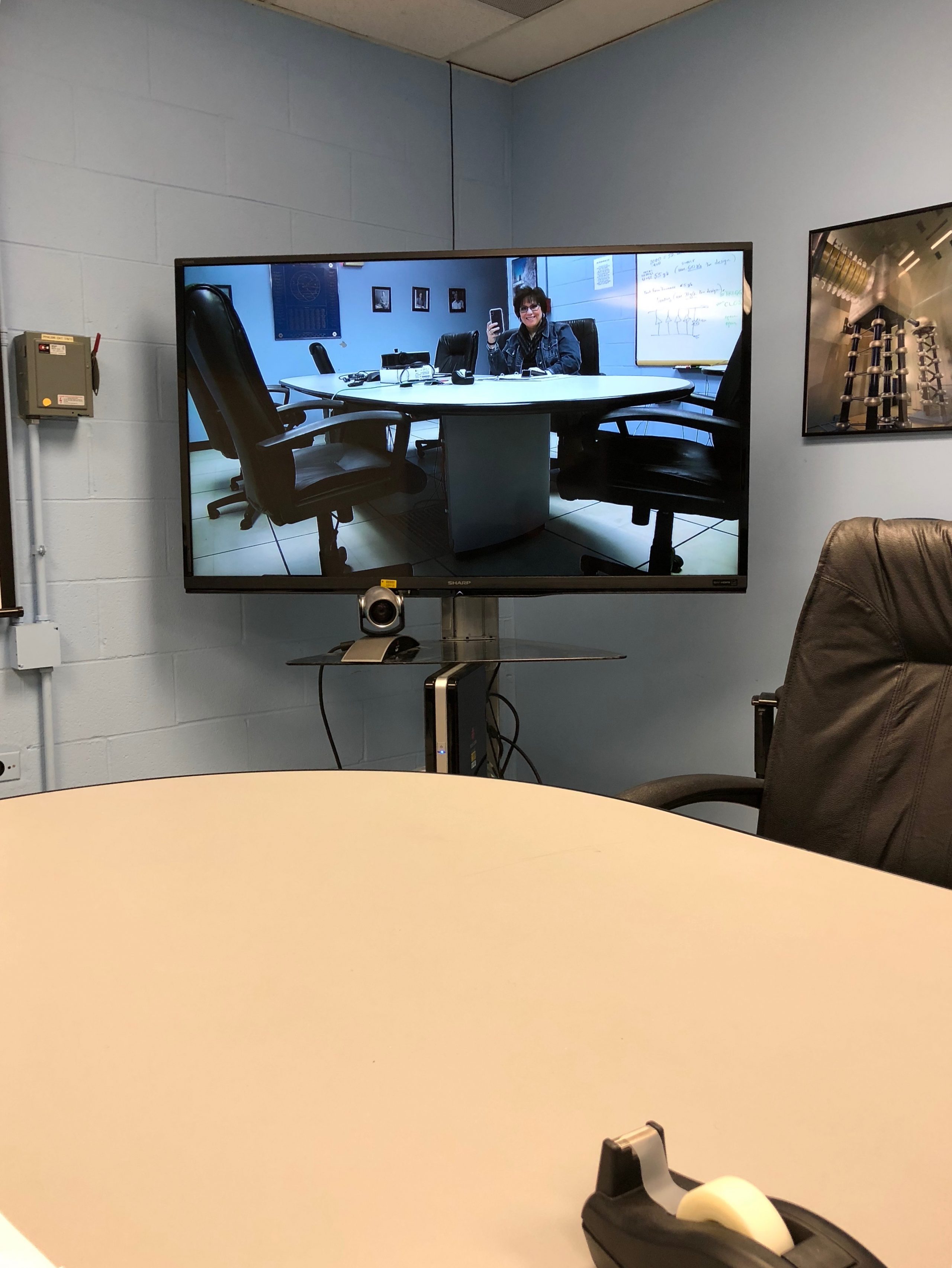 The Blue Room video conference room needed a reboot, so I, Leticia, walked over to Lab F to do so. Photo: Leticia Shaddix, people
