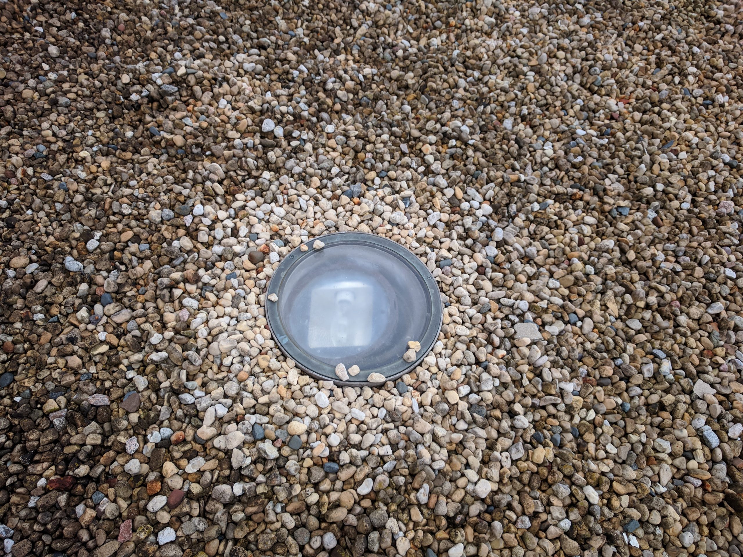 This light outside the Ramsey Auditorium warms and dries the gravel around it on a recent damp morning. Photo: Jason St. John, everyday objects