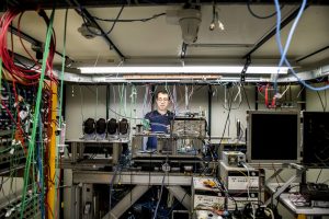 Artur Apresyan works on electronics and instrumentation in a beamline at Fermilab for the Large Hadron Collider's CMS detector. Photo: Reidar Hahn