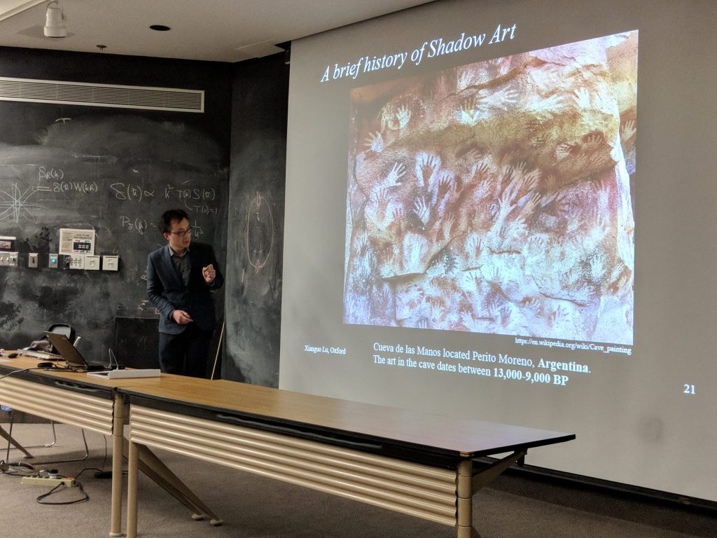 Xianguo Lu from University of Oxford explains why neutrinos leave no shadows at the March 2, 2018 Fermilab Wine &amp; Cheese Seminar. Photo: Kevin McFarland