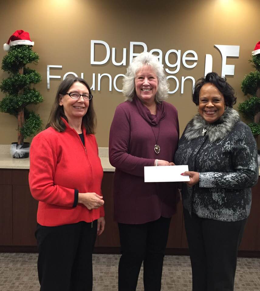 Dupage Foundation's Dianne Engram presents the $12,000 grant to FNA Vice President Liz Copeland, with FNA President Penny Kasper. Photo courtesy of Liz Copeland
