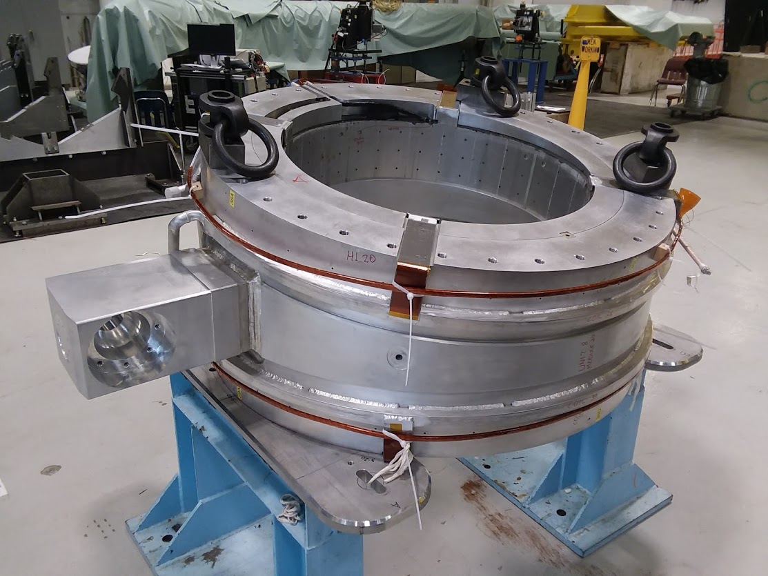 Our group used two cranes to rotate test unit TSUN08 from the bore-tube-horizontal warm testing position (pictured above) to the bore-tube-vertical cold testing position (seen here). Mu2e, technology, magnet, operations Photo: Jeff Brandt