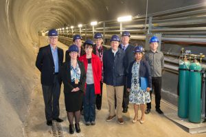 Louise Suter (front left) and members of the Fermilab Neutrino Department took visitors on a tour 350 feet underground to talk about current and future long-baseline neutrino experiments, NOvA and DUNE.
