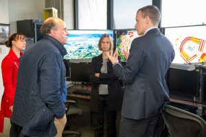 In Fermilab’s Remote Operations Center East, Under Secretary Paul Dabbar (second from left) receives a briefing by Kevin Burkett and Anadi Canepa on the U.S. participation in experiments at the Large Hadron Collider at the European research center CERN.