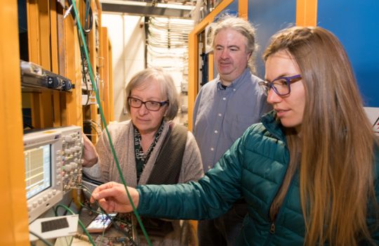 From left: Donatella Torretta, Bill Badgett and Angela Fava fine tune the White Rabbit synchronization system for the Fermilab Short-Baseline Neutrino Program. Photo: Reidar Hahn