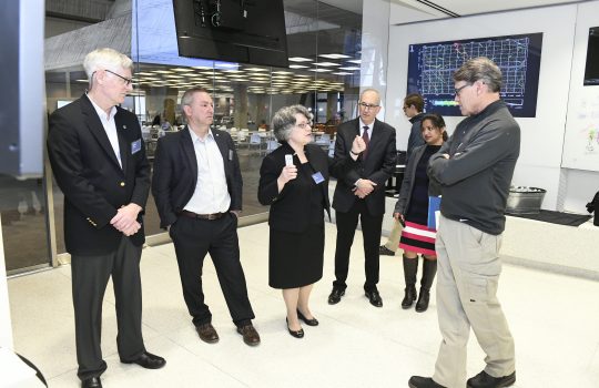 Energy Secretary Rick Perry, far right, hears about Fermilab's neutrino program, including the international Long-Baseline Neutrino Facility and Deep Underground Neutrino Experiment. From left: Fermilab Deputy Director for LBNF Chris Mossey, Fermilab Director Nigel Lockyer, incoming Fermilab PIP-II Project Director Lia Merminga, University of Chicago Executive Vice President for Research, Innovation and National Laboratories Eric Isaacs, Fermilab Chief of Staff Hema Ramamoorthi, U.S. Energy Secretary Rick Perry. Photo: Reidar Hahn