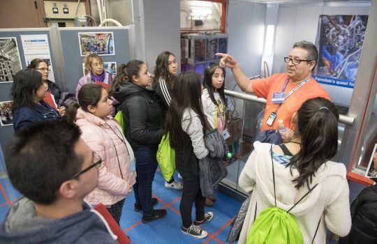 Jose de la O leads a group on a tour of the lab's accelerators. Photo: Reidar Hahn