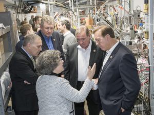 Congressmen (from left) Andy Biggs, Frank Lucas, Neal Dunn and Randy Weber listened to Lia Merminga as she gave visitors a tour of Fermilab’s work on testing equipment for a new superconducting particle accelerator. Photo: Reidar Hahn