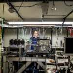 Artur Apresyan works on electronics and instrumentation in a beamline at Fermilab for the Large Hadron Collider's CMS detector. Photo: Reidar Hahn