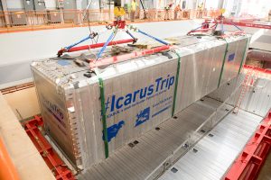 The first of two ICARUS detector modules is lowered into its place in the detector hall. Photo: Reidar Hahn