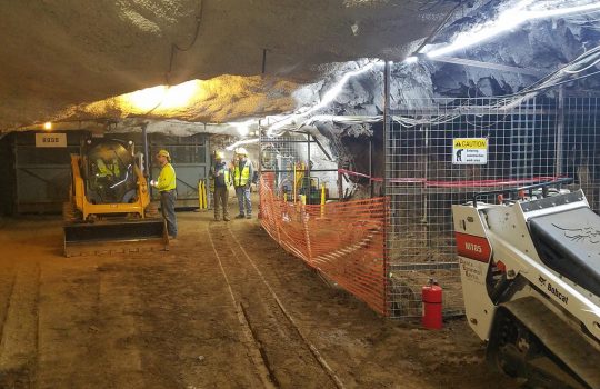 Existing spaces a mile underground on the 4850 Level are being rehabbed to prepare for the excavation of the LBNF caverns. The space shown here is the area that will be used for loading rock into the buckets (“skips”) to transport it up the Ross Shaft. Credit: Fermilab