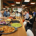 The Asian and Pacific American community at Fermilab gathers to eat and talk at the group's first meet-and-greet. Photo: Alex Chen