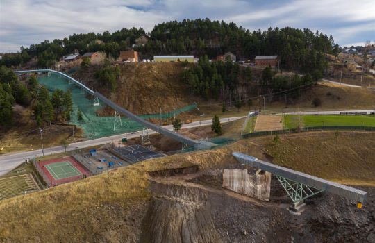 The conveyor belt taking the rocks from the crusher to the Open Cut passes close to the town of Lead, South Dakota. Image: Fermilab