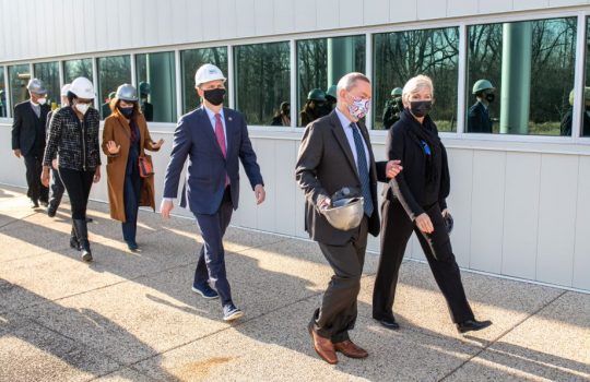 People wearing masks walking outside