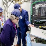 Fermilab Director Lia Merminga views a QICK box in the QUIET underground laboratory at Fermilab. Photo: Dan Svoboda, Fermilab