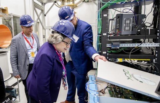 Fermilab Director Lia Merminga views a QICK box in the QUIET underground laboratory at Fermilab. Photo: Dan Svoboda, Fermilab