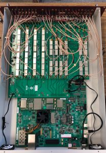 Components of the QICK box, which includes the QICK open-source software and hardware components on an off-the-shelf radio frequency system-on-chip (RFSoC) board (bottom) and the new customizable companion board (top). The Fermilab team wants to commercialize the companion board. Photo: Sara Sussman