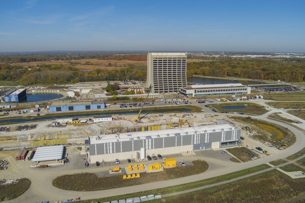 An aerial view of the PIP-II site with the Cryogenic Plant Building in the foreground