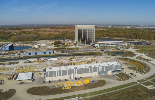 An aerial view of the PIP-II site with the Cryogenic Plant Building in the foreground