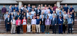 Caption: Researchers gather for a group photo during the International Workshop on Ionization Cooling Demonstrator. Photo: Dan Svoboda, Fermilab.