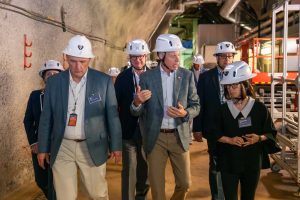 Secretary of Energy Chris Wright (center) speaks with Interim Director of Fermilab Young-Kee Kim (right) as Project Director of LBNF-DUNE-US Jim Kerby (second from left) and President of University of Chicago Paul Alivisatos (third from left) walk with them during an underground tour of DUNE prototype detectors and quantum and dark matter labs on July 17, 2025. Credit: Ryan Postel, Fermilab