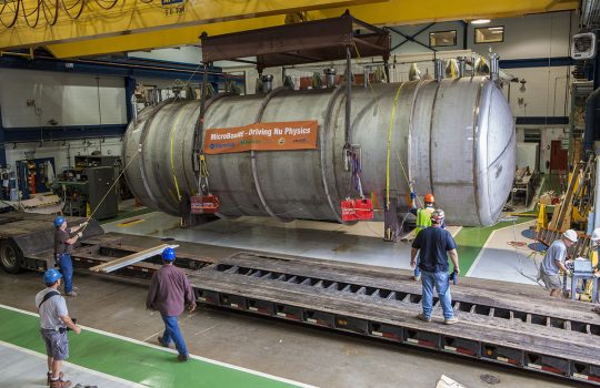 The MicroBooNE detector was carefully transported by truck across Fermilab to the experiment hall in 2014. Credit: Cindy Arnold, Fermilab