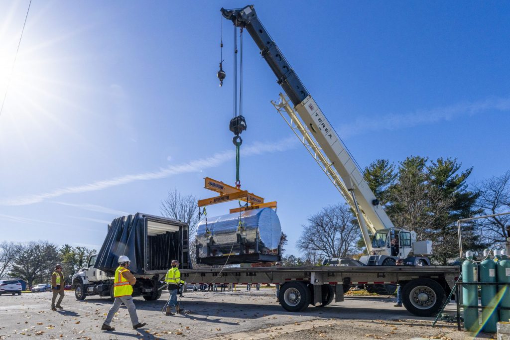 The first Mu2e tracker module is successfully moved from the production clean room to the Mu2e experiment hall. Credit: Ryan Postel