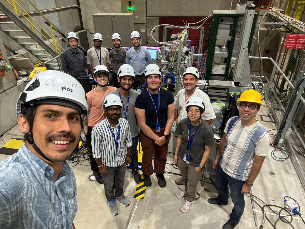 A research team led by Fermilab conducted a study to test the ability of superconducting microwire single photon detectors to efficiently detect high-energy particles at CERN’s accelerator test beam. Their research represents a significant step forward in determining SMSPD suitability for use in next-generation detectors. Pictured in the front row, from left to right, are Cristián Peña, Thomas Sievert, Manish Sahu, Alex Albert, Elise Sledge, Adi Bornheim, Christina Wang and Artur Apresyan. In the back row, from left to right, are Shuoxing Wu, Towsif Taher, Guillermo Reales Gutierrez and Boris Korzh. Credit: Cristián Peña, Fermilab
