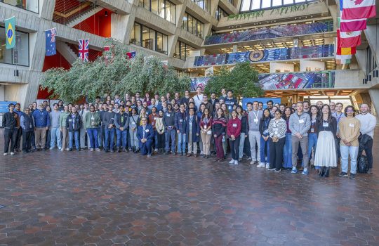 Participants in the 2026 CMS Data Analysis School enjoyed seeing three banners depicting the CMS detector, top right, hanging in the Wilson Hall atrium. Similar banners showcase CMS in a central gathering place at CERN. Credit: JJ Star, Fermilab