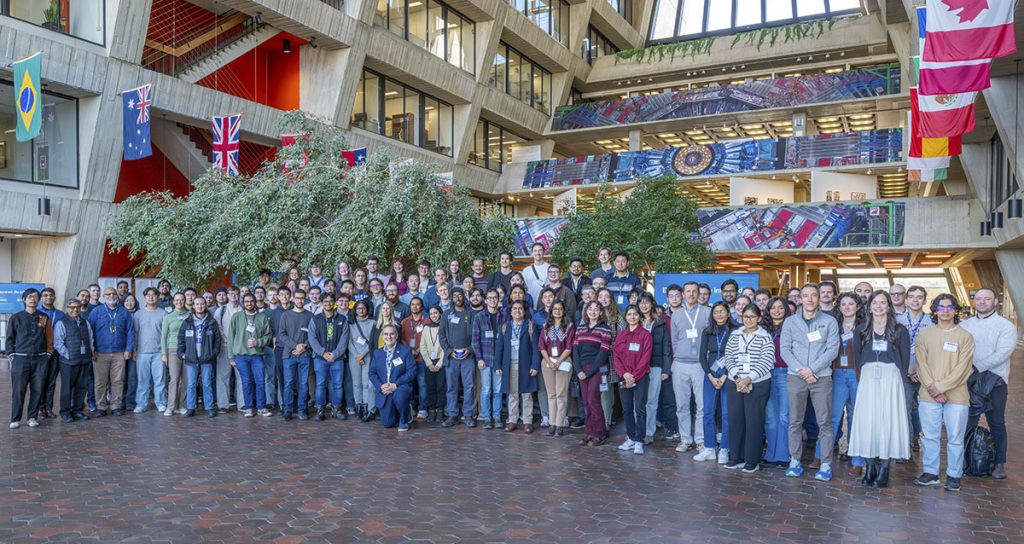Participants in the 2026 CMS Data Analysis School enjoyed seeing three banners depicting the CMS detector, top right, hanging in the Wilson Hall atrium. Similar banners showcase CMS in a central gathering place at CERN. Credit: JJ Star, Fermilab