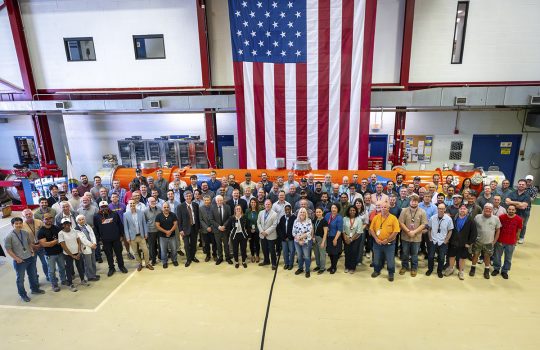 Fermilab team members in front of the 14th and final superconducting cryomodule built for the high-energy LCLS upgrade. Credit: JJ Starr, Fermilab