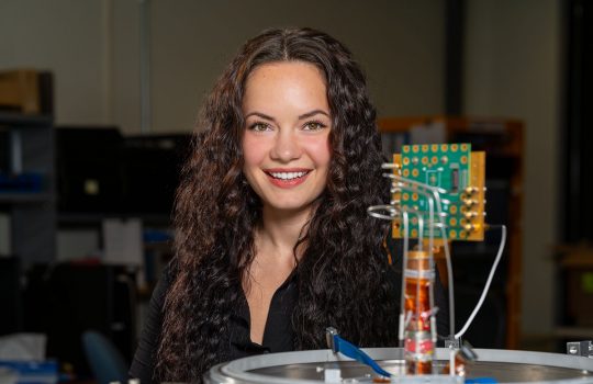 Olivia Seidel using AI to study how transistors behave in extreme cold. Credit: JJ Starr, Fermilab