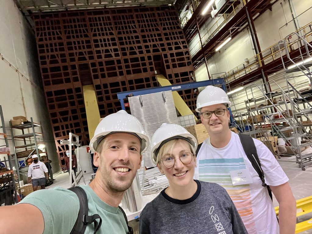 Linda Cremonesi, center, stands with members of her team in front of the NOvA far detector in 2022. Credit: Courtesy Linda Cremonisi