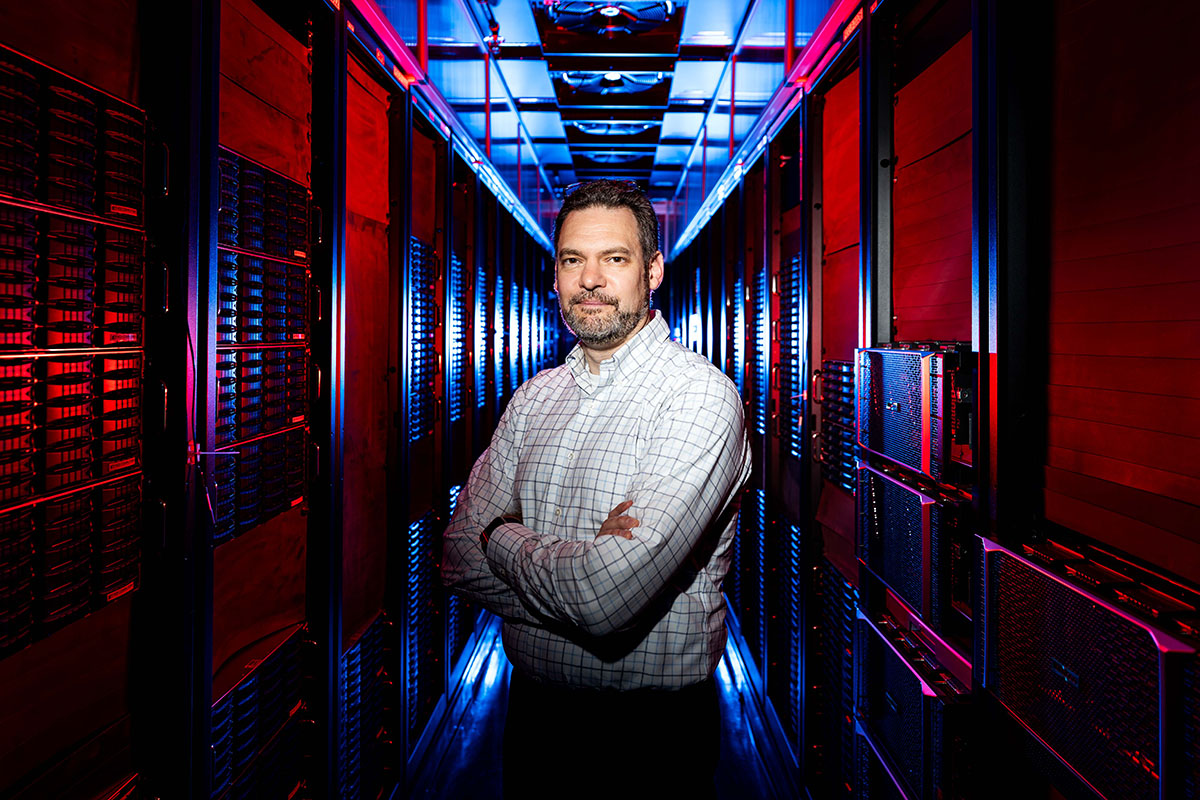 Oliver Gutsche, shown amidst rows of hard disk drives in the computing center at Fermilab, is the lead for the Fermi Data Platform project.
