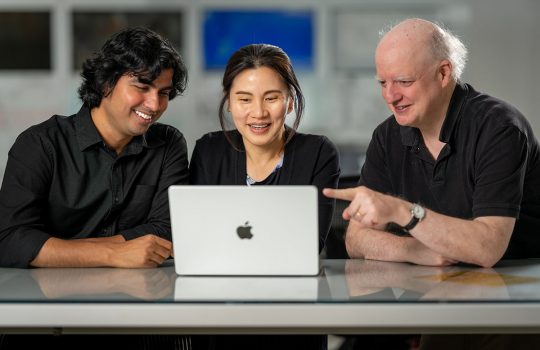 The Deep Underground Neutrino Experiment is pioneering artificial intelligent tool integration into the experiment to empower DUNE scientists and accelerate scientific discovery. Pictured, left to right, are Vishvas Pandey, Seon Hee Seo and Thomas Junk. Credit: JJ Starr, Fermilab