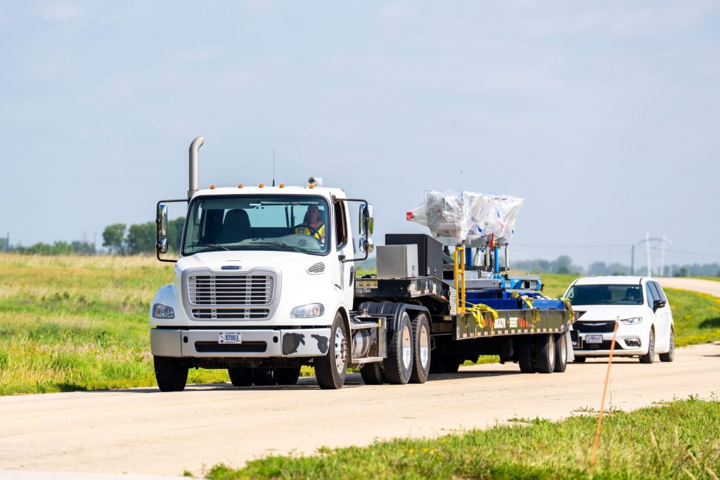 The radio-frequency quadrupole (RFQ) at Fermilab being carefully transported to its new home in the High Bay Building and will be the heart of the front end of the PIP-II linac. Credit: Ryan Postel, Fermilab