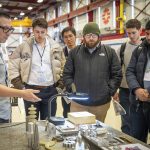 How it’s made – Machining Specialist, Eddie Pieszchala (left) shares an overview of highly customized components he makes – many of which are used in the SQMS Center.
