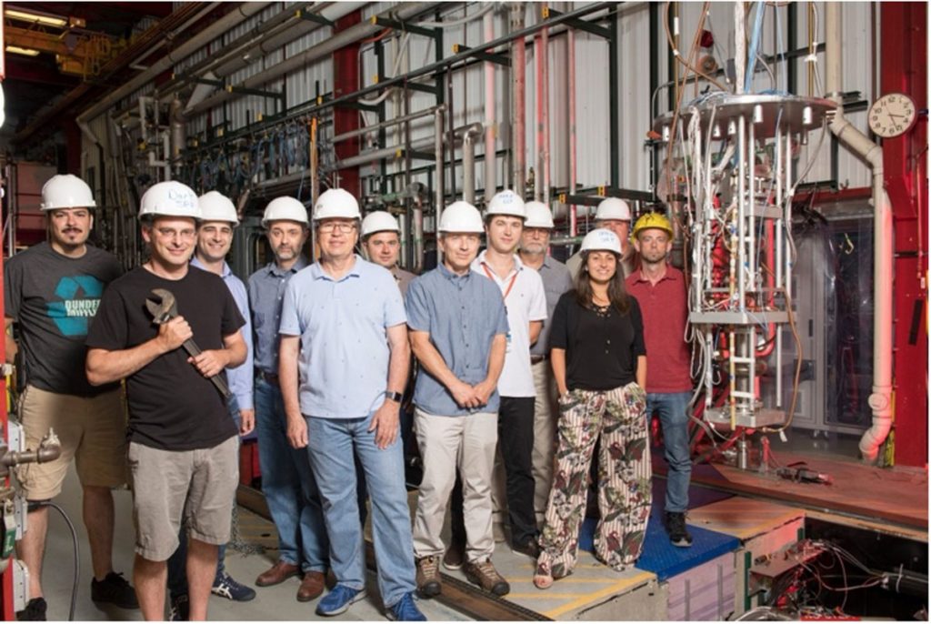 Members of the team behind DarkSRF. From left to right: Abe Diaz, Roni Harnik, Sam Posen, Oleksandr Melnychuk, Yuriy Pischalnikov, Roman Pilipenko, Oleg Pronitchev, Alexander Romanenko, Sergey Belomestnykh, Anna Grassellino, Dave Burk, Damon Bice. August 2019, Photo credit Reider Hahn, Fermilab.