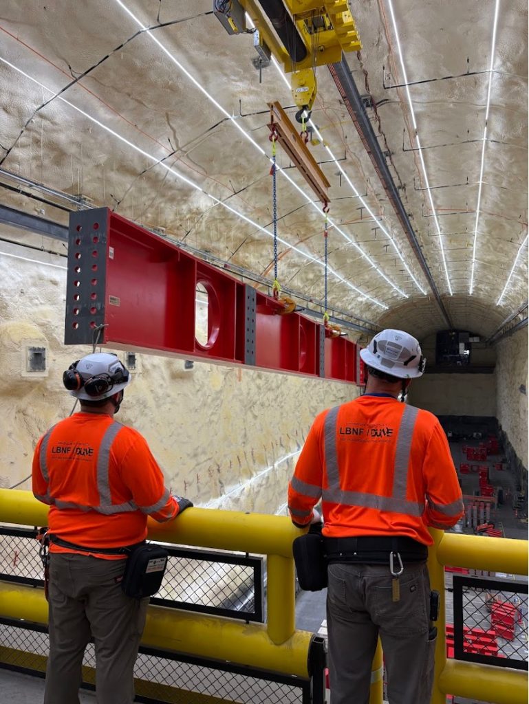 A massive steel beam for DUNE is delivered to the south cavern, nearly a mile below the surface at the Sanford Underground Research Facility in Lead, South Dakota. The research space, more than 500 feet long and about seven stories tall, will house one of the experiment’s massive detector modules. Credit: Thomas Wieber, Fermilab