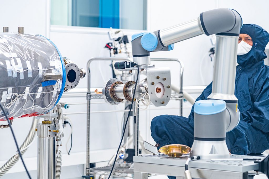 This summer, the PIP-II team reached an important milestone: a cobot autonomously aligned a coupler on an SRF cavity in a clean room. Credit: Ryan Postel and JJ Starr