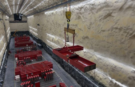 An L-beam for a DUNE cryostat is moved in the south cavern, which is nearly a mile below the surface at the Sanford Underground Research Facility. The research space, more than 500 feet long and about seven stories tall, will house one of the experiment’s massive detector modules. Credit: Aaron Thompson, Fermilab